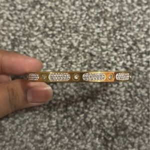 Gold adjustable bracelet with diamond embellishments